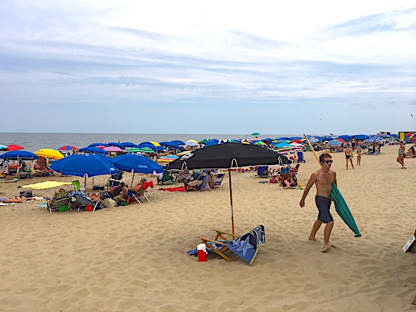Soft sand and beach umbrellas make for a relaxing day